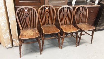 Lot 1057 - Four old wheel back kitchen chairs and similar wheel back elbow chair (5)