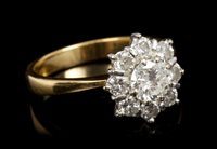 Lot 443 - Diamond cluster ring, the flower-head cluster...