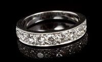 Lot 444 - Diamond nine stone eternity ring with nine...