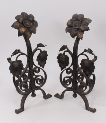 Lot 854 - Pair of Arts and Crafts wrought iron fire dogs