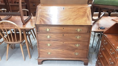 Lot 1060 - Georgian mahogany bureau with fitted interior and four long graduated drawers below on bracket feet