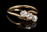 Lot 449 - Diamond three stone crossover ring with three...