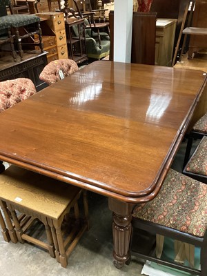 Lot 1066 - Victorian mahogany wind out extending dining table with one extra leaf on reeded turned legs, 174cm x 118cm extended, with winding handle