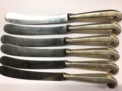 Lot 842 - Set of six dinner knives with silver pistol grip handles and engraved monogram (London 1912)