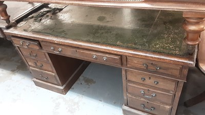 Lot 1094 - Edwardian oak Partners desk with green leather lined top and numerous drawers 153 x 122 cm