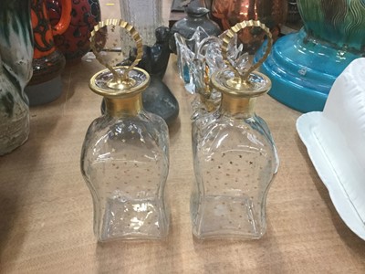 Lot 484 - Pair of glass decanters of pinched form with gilt decoration.