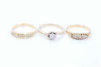 Lot 457 - Three gold and diamond rings - various - to...