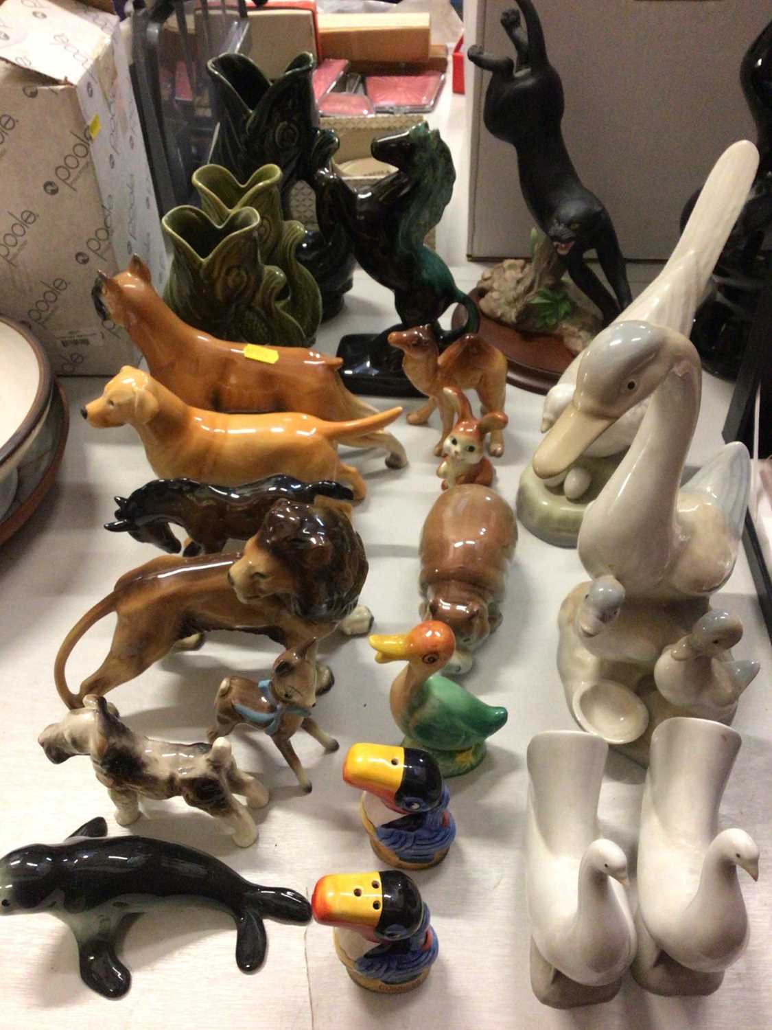 Lot 263 - Group of animal ornaments including three fish glug jugs, Beswick dog, pair of Nao doves and Guinness toucan salt and pepper set