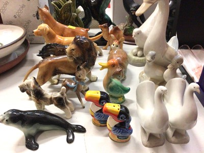 Lot 263 - Group of animal ornaments including three fish glug jugs, Beswick dog, pair of Nao doves and Guinness toucan salt and pepper set