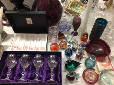 Lot 264 - Group of coloured glassware including various paperweights, Wedgwood duck, Caithness vase, large amethyst glass bottle vase, set of four Edinburgh Crystal wine glasses in box, other cut glass ware...