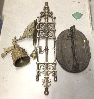 Lot 280 - Cast iron boot scraper, cast metal architectural mount and a brass wall mounted bell