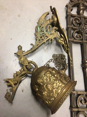 Lot 280 - Cast iron boot scraper, cast metal architectural mount and a brass wall mounted bell