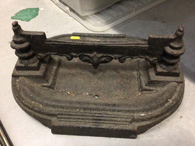 Lot 280 - Cast iron boot scraper, cast metal architectural mount and a brass wall mounted bell