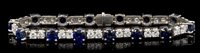 Lot 459 - Diamond and sapphire bracelet with an...