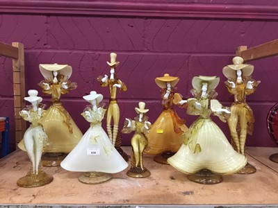 Lot 630 - Eight Murano glass amber coloured  figures