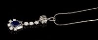 Lot 460 - Diamond and sapphire pendant with a pear-shape...