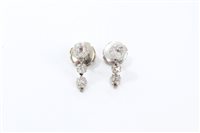 Lot 461 - Pair diamond pendant earrings, each with three...