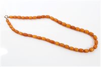 Lot 465 - Old amber bead necklace with a string of...