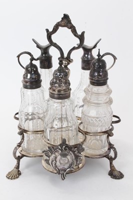 Lot 230 - George III silver cruet stand, the glass bottles associated