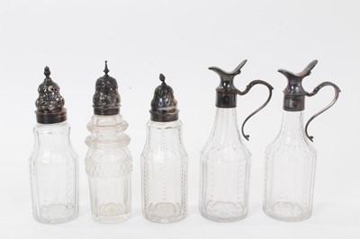 Lot 230 - George III silver cruet stand, the glass bottles associated