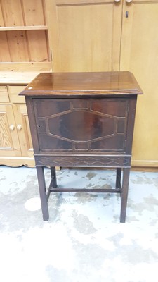 Lot 1134 - Early 20th century mahogany music cabinet with blind fret decoration with four slides, 57cm wide, 39cm deep, 86cm high