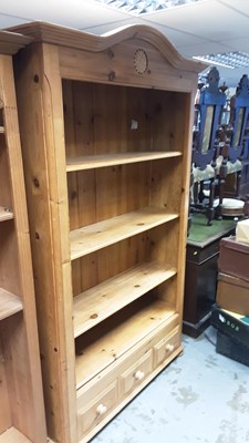 Lot 1146 - Pine open bookcase with domed top, adjustable shelves and three drawers below, 118cm wide, 35cm deep, 198cm high