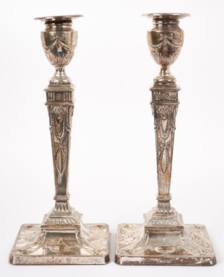 Lot 294 - A pair of Edwardian silver candlesticks