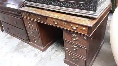 Lot 1155 - Late Victorian mahogany twin pedestal desk with inset leather lined top and eight drawers below with brass handles, 124cm wide, 84cm deep, 79cm high