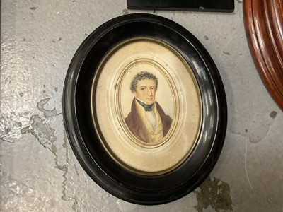 Lot 165 - Two 19th century oval watercolour portraits on paper, a printed miniature and an overpainted 17th century style miniature