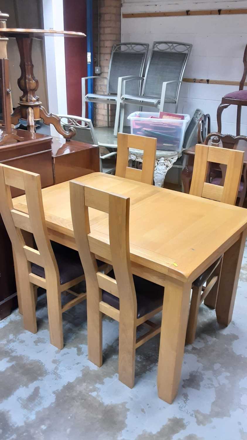 Lot 1167 - Contemporary light oak dining table and four chairs