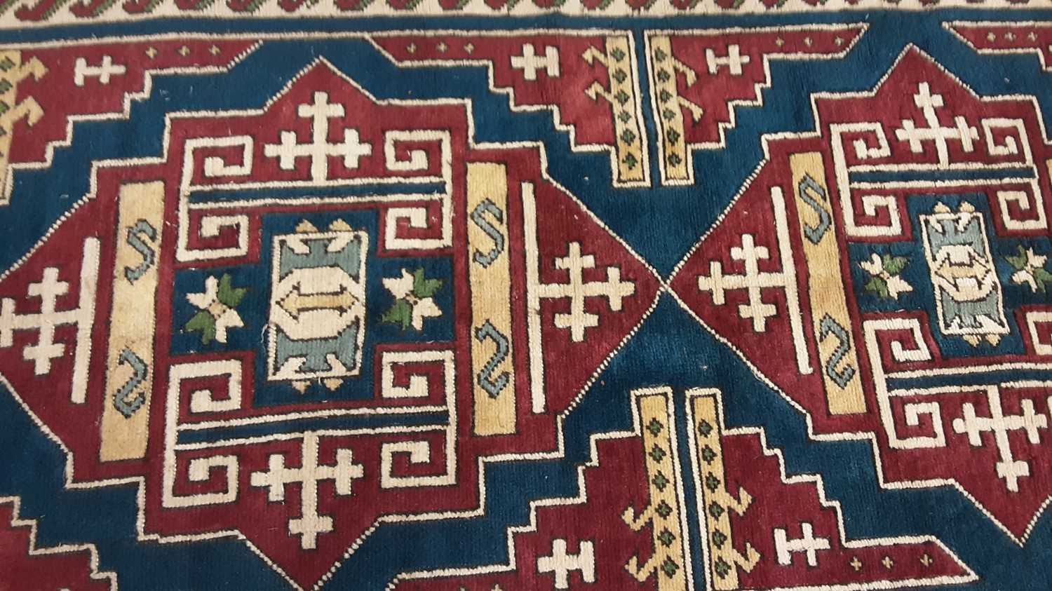 Lot 1194 - Eastern rug with geometric decoration on