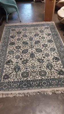 Lot 1197 - Super Keshan wool rug with floral decoration on blue and cream ground, 238cm x 171cm