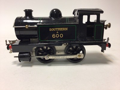 Lot 58 - Hornby O gauge 0-4-0 clockwork locomotives including Southern black A600, LNER green 460, BR black red lined 82011 and one other (4)
