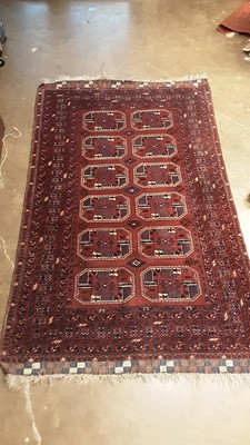 Lot 1204 - Eastern rug with twelve central medallions on maroon, blue and cream ground, 208cm x 125cm