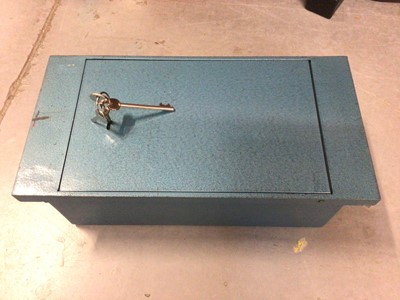 Lot 320 - Metal floor/wall safe with keys