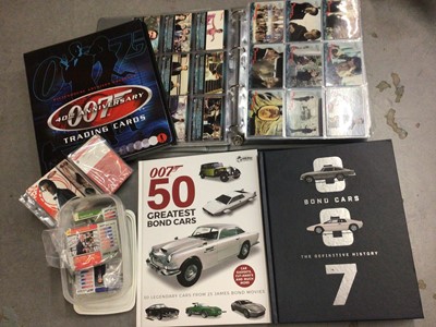 Lot 325 - Collection of James Bond 007 trading cards, within two folders, plus some loose and two Bond cars books