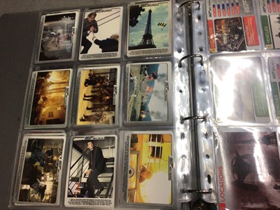 Lot 325 - Collection of James Bond 007 trading cards, within two folders, plus some loose and two Bond cars books