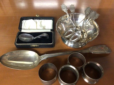 Lot 877 - Silver dish, set of six silver teaspoons with monogram decoartion, silver christening spoon in fitted case, silver tablespoon and four silver napkin rings