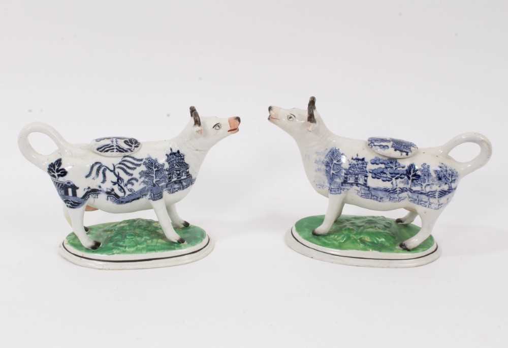 Lot 6 - A pair of 19th century Staffordshire pottery Willow pattern cow creamers