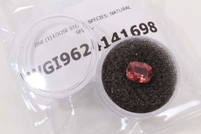 Lot 543 - Unmounted cushion shape mixed cut natural orangey pink spinel weighing approximately 2.32cts, with World Gemmological Institute Report