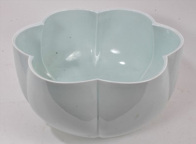 Lot 52 - A large and finely potted 20th century Japanese celadon glazed porcelain bowl, of six-petal flower form, possibly by Terui Ichigen, signed to base, 39cm diameter, in original wooden storage box