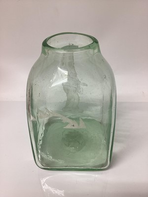 Lot 27 - Green glass vessel depicting an elderly Jewish man