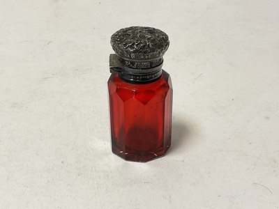 Lot 120 - Victorian ruby glass scent bottle with floral embossed silver top
