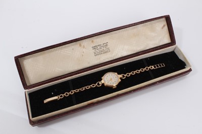 Lot 588 - 1950's ladies' 9ct gold Garrard & Co wristwatch with silvered dial, gold coloured Arabic numerials and subsidiary seconds