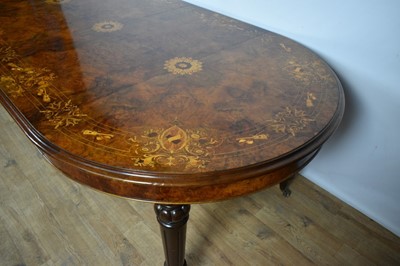 Lot 1368 - Victorian style figured walnut and inlaid dining table with two additional leaves