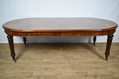 Lot 1368 - Victorian style figured walnut and inlaid dining table with two additional leaves