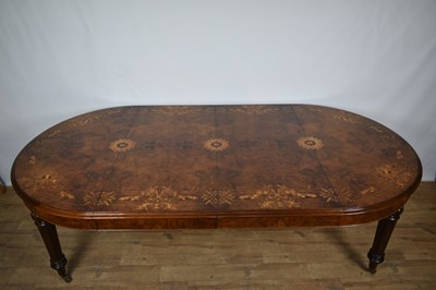 Lot 1368 - Victorian style figured walnut and inlaid dining table with two additional leaves