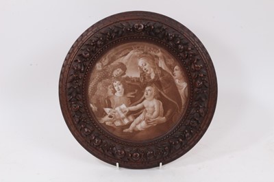 Lot 835 - Finely carved 19th century walnut circular frame, carved with fruiting wreath in lambrequin and beaded borders, 29cm diameter, housing print after Botticelli