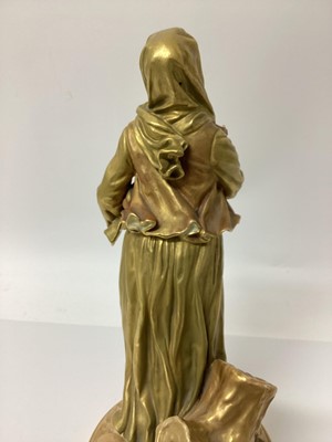 Lot 23 - An early 20th century Royal Worcester figure of a musician, modelled in gilt as a lady with a drum, signed Hadley with puce mark to base and number 1567