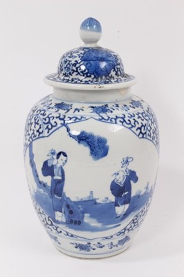 Lot 45 - A 19th century Chinese blue and white porcelain vase and cover, decorated with figural scenes, 23cm high, together with a miniature 19th century Chinese famille rose teapot, 7.5cm high